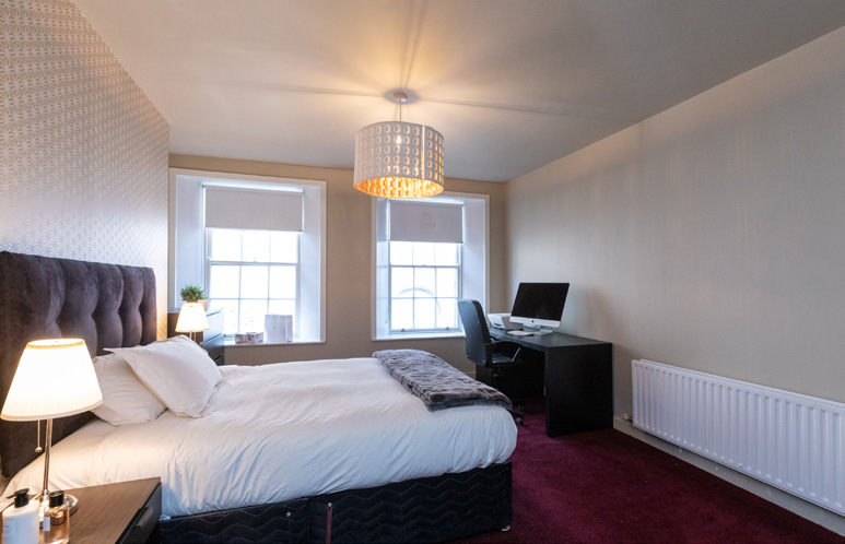 Apartment bedroom — April 2024 marketing photograph